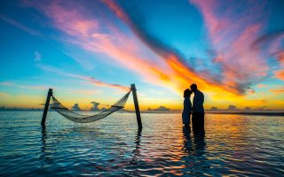 Silhouette Photo Couple Kissing Each Other during Sunset